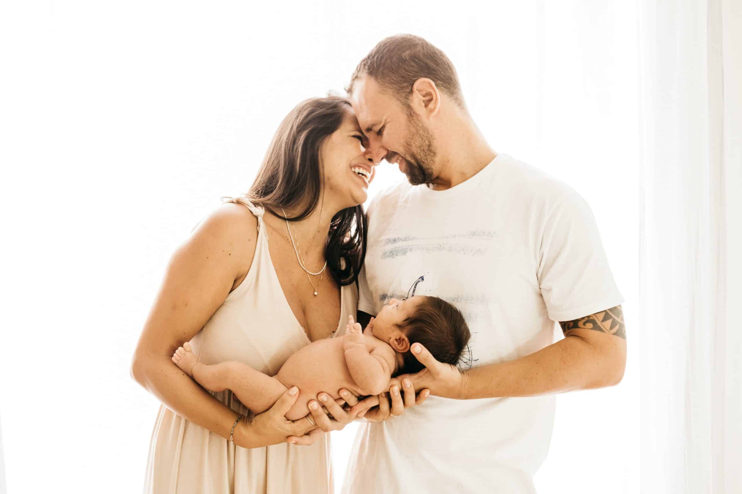 Most Popular Baby Names in 2002 man in white crew neck t-shirt kissing woman in white dress