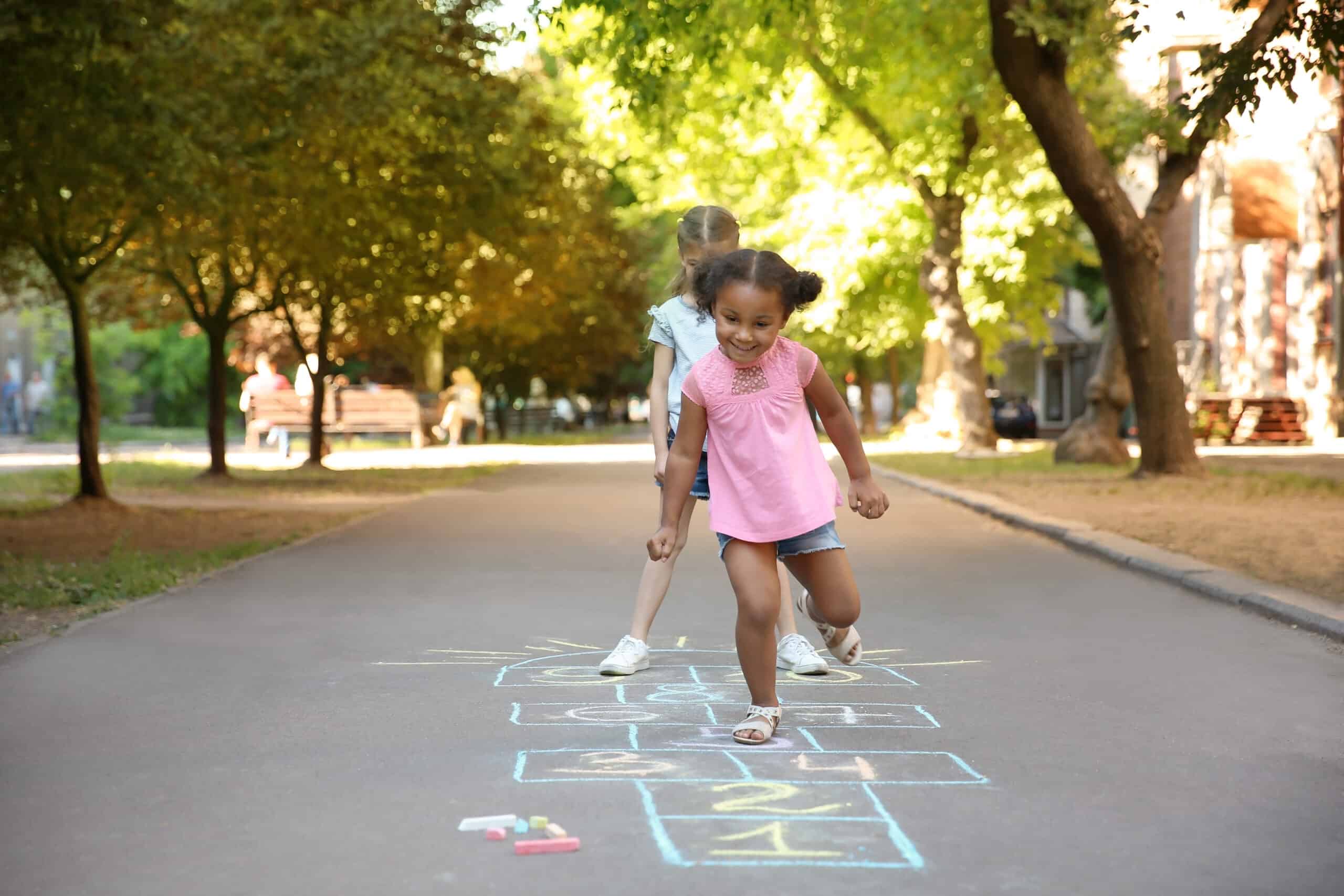 girls playing hopscotch, a classic outdoor game