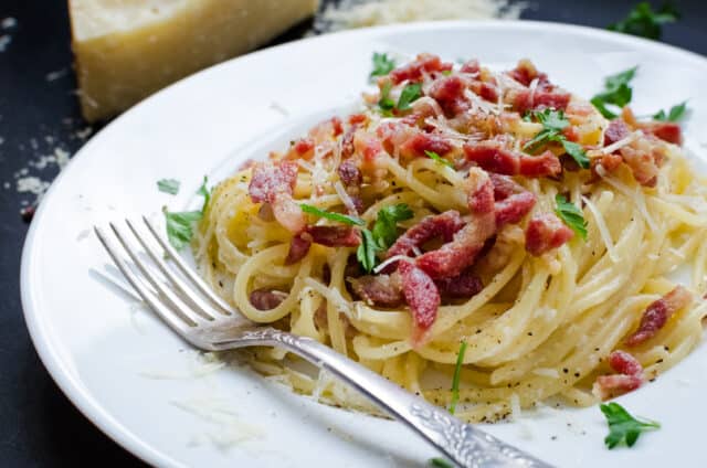 Pasta Carbonara. Spaghetti with bacon, parsel and parmesan cheese.