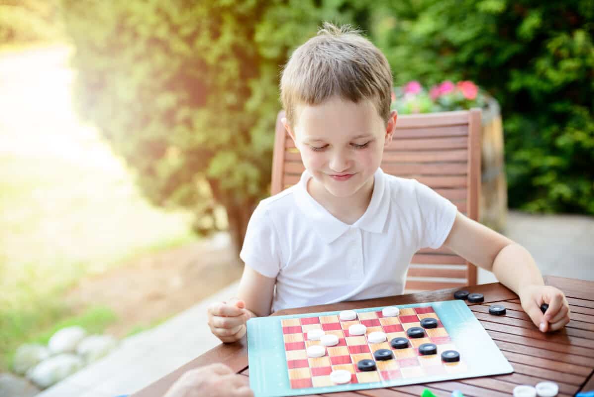 kid playing checkers