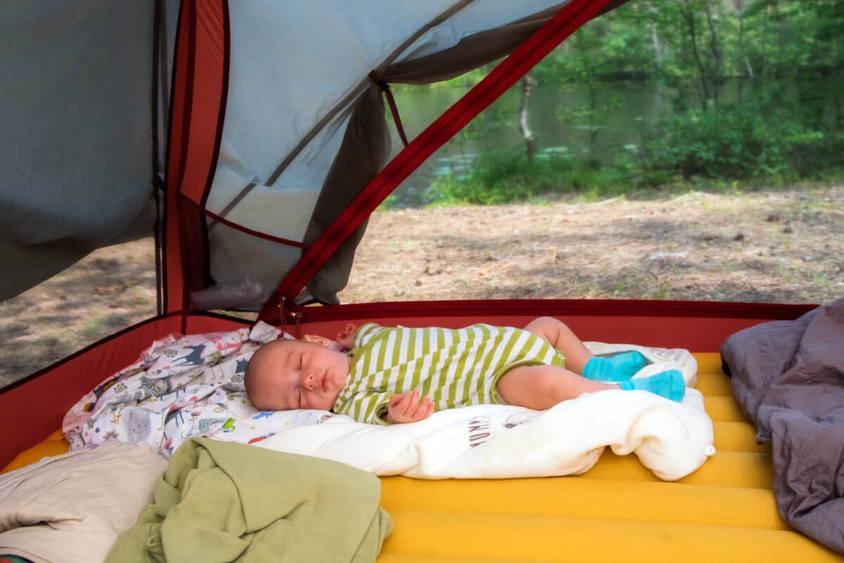 camping with a baby napping in a tent