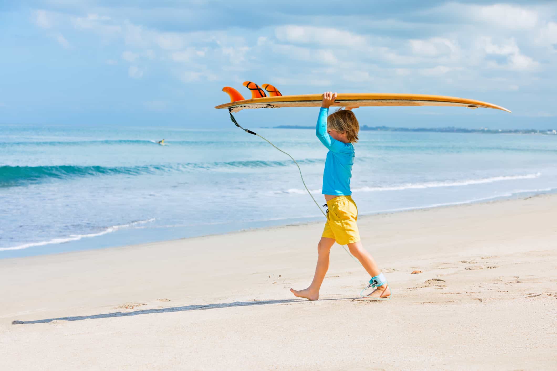 surfboard boy on a beach