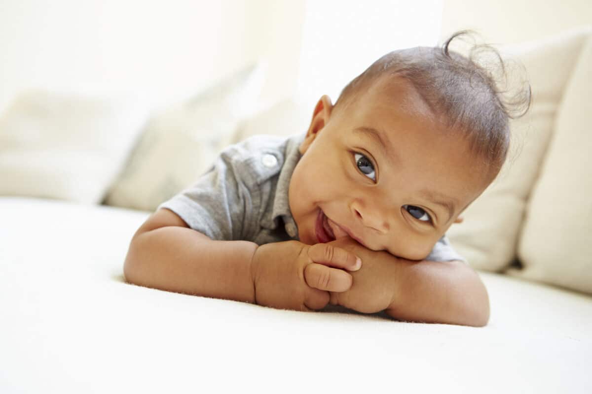 Baby boy smiling at camera