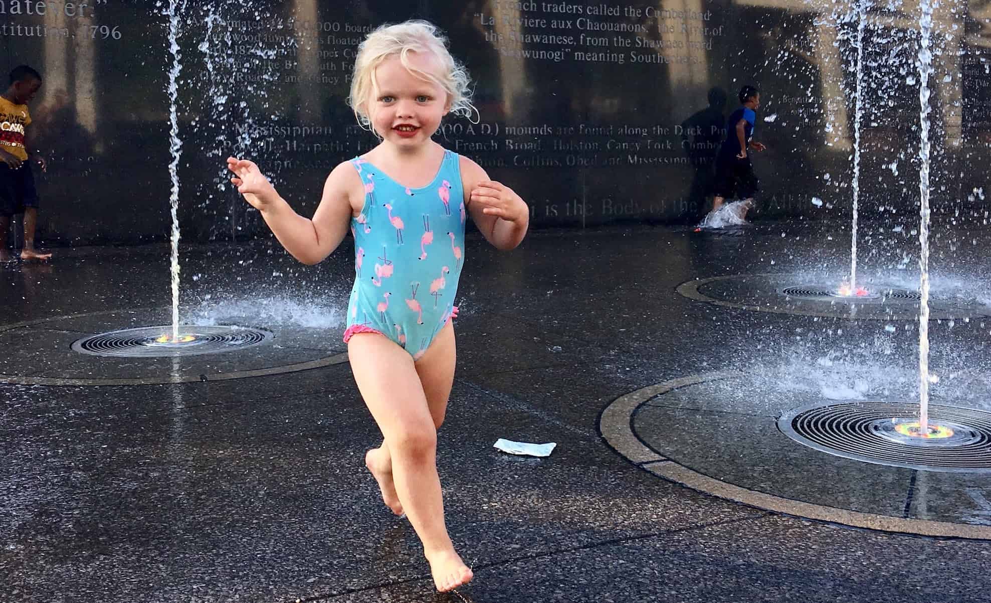 girl and a splash pad