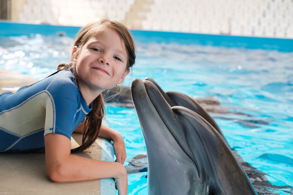 child with dolphin