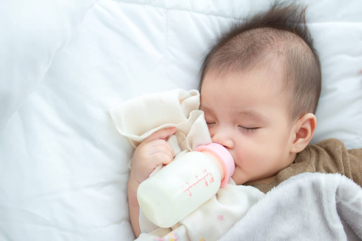 baby eat milk sleeping Feeding baby care concept