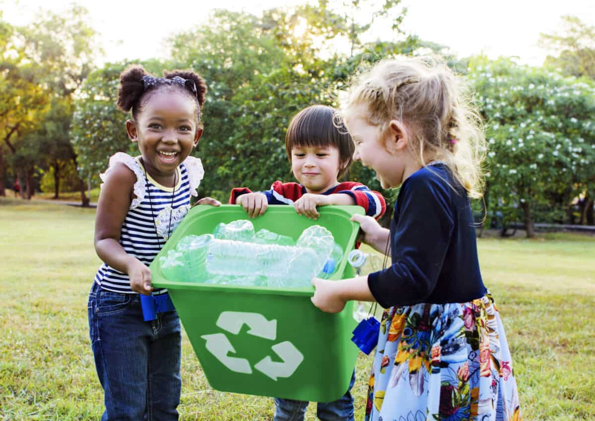 Kids recycling together.