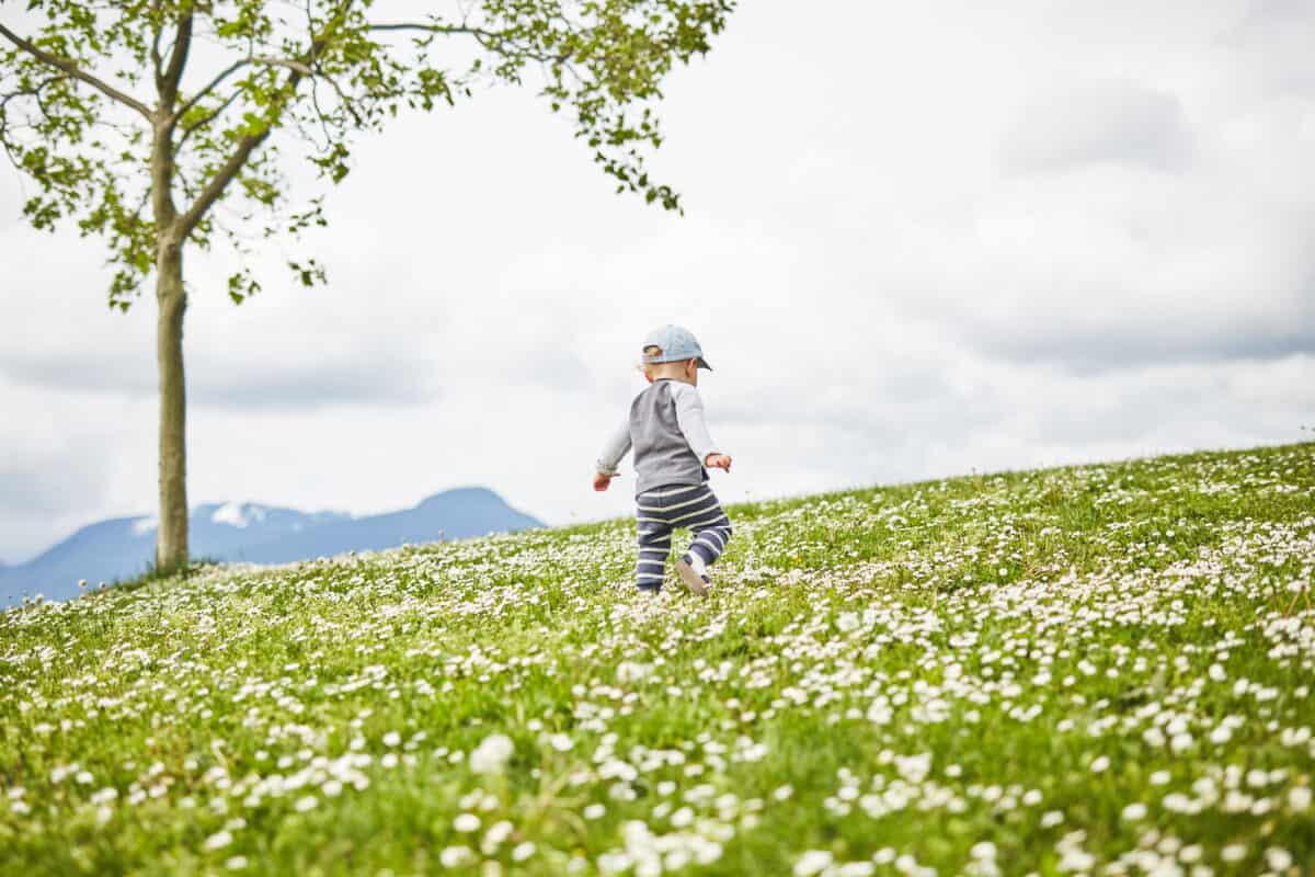 Playing on a hill can give a child a sense of wonder while out in nature. Best Things for Kids To Do Outside