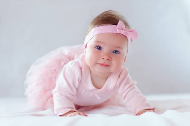 pretty baby girl in pink dress