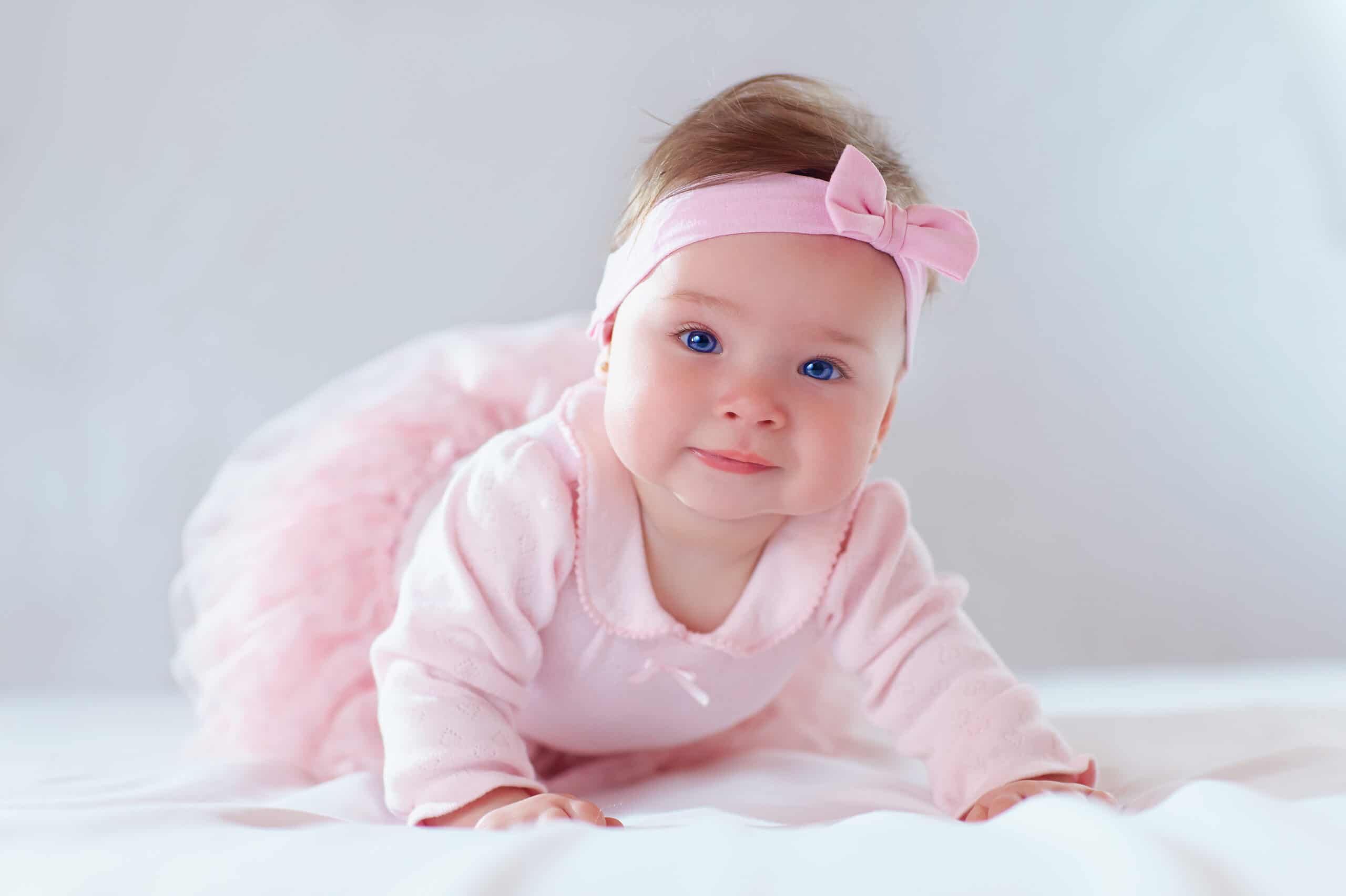 pretty baby girl in pink dress