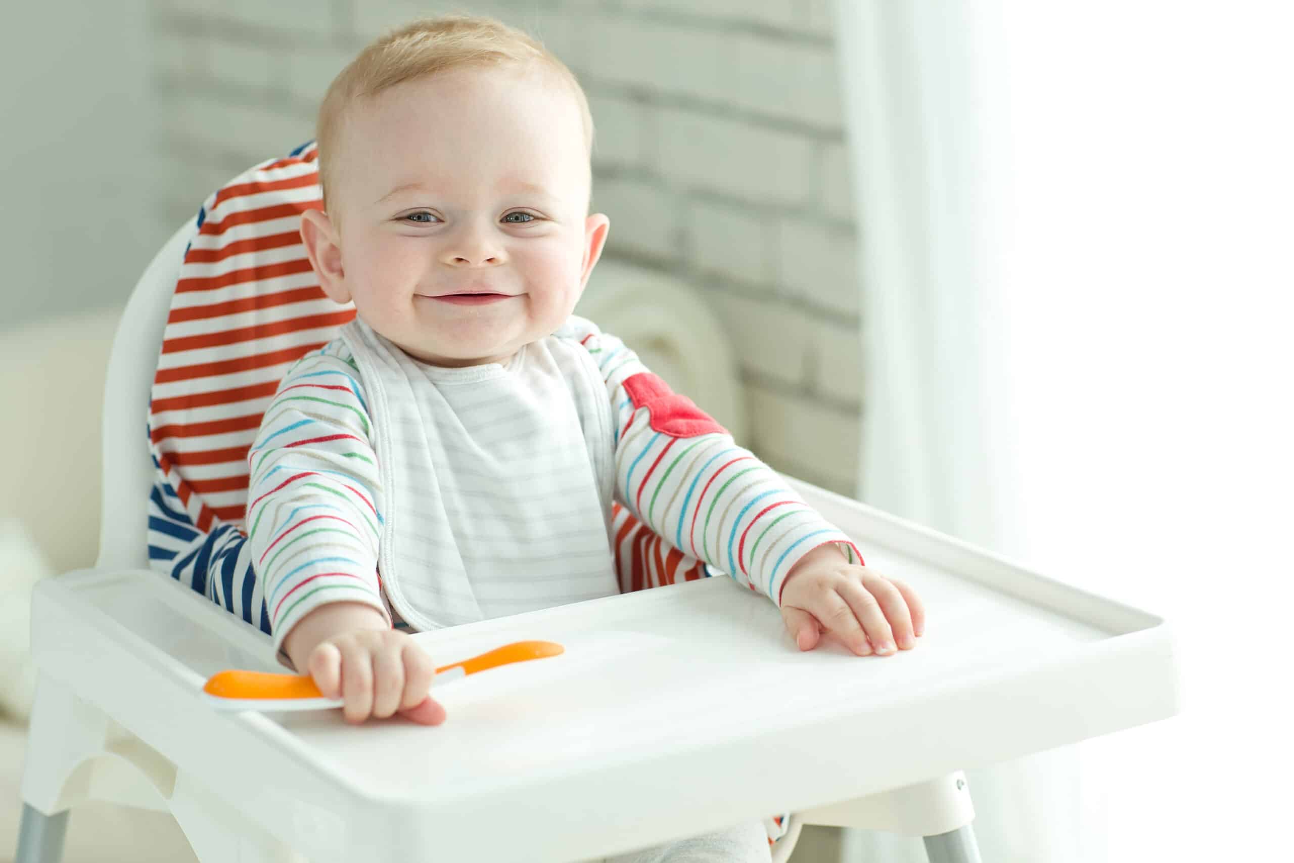 baby sitting in high chair