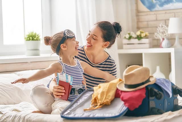 Mom getting ready for trip with child