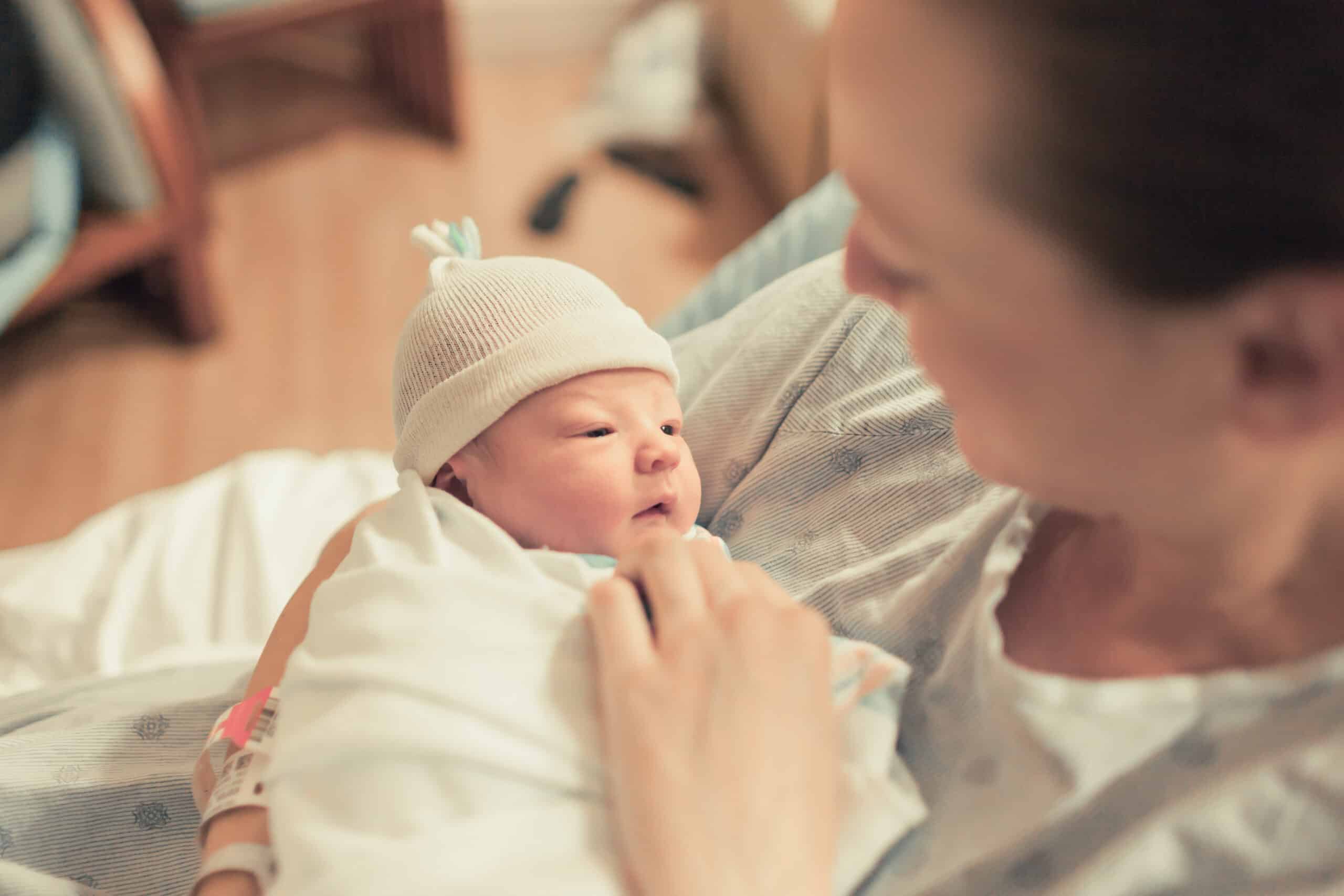 Newborn baby with mother in hospital