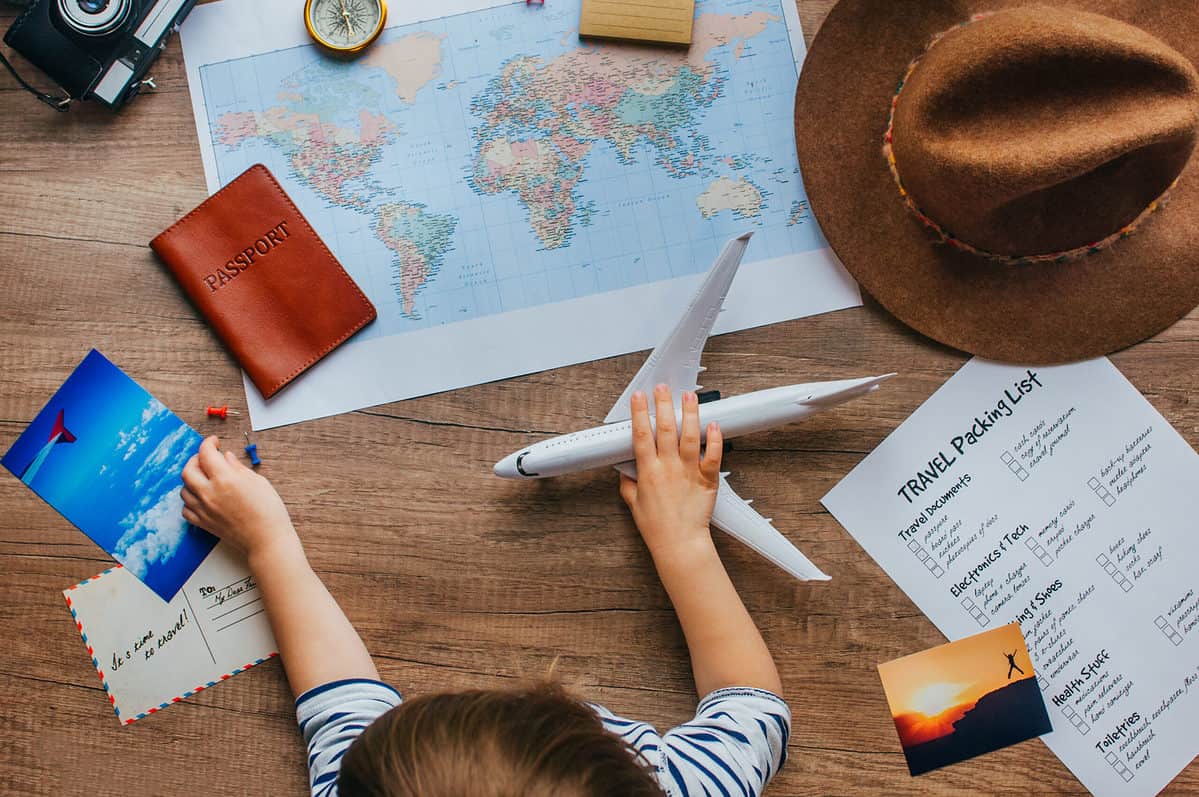 Child playing with plane before a trip