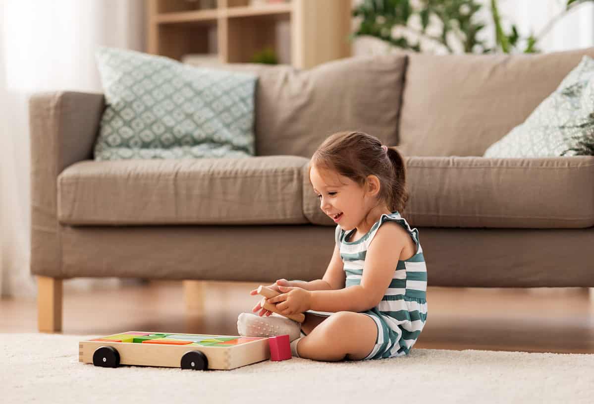 3 year old playing with toy