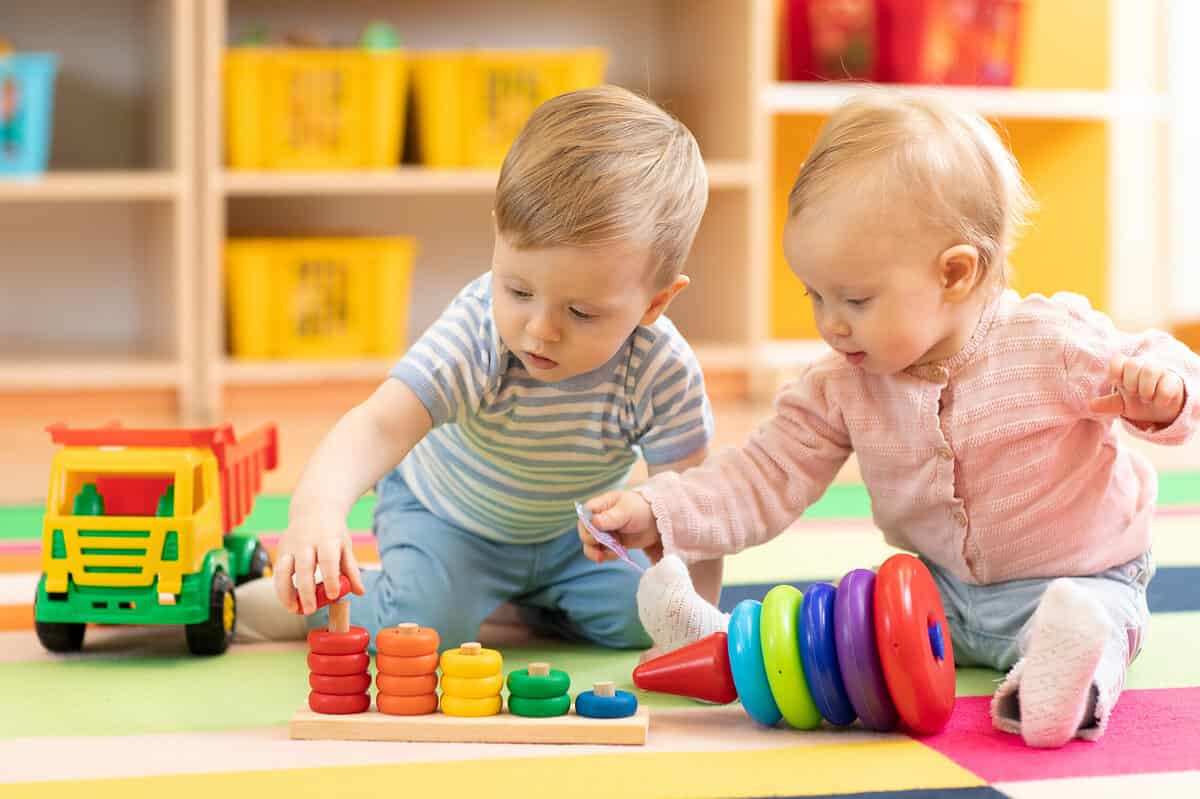 toddlers playing with toy