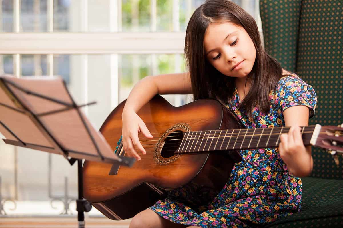 girl playing the guitar