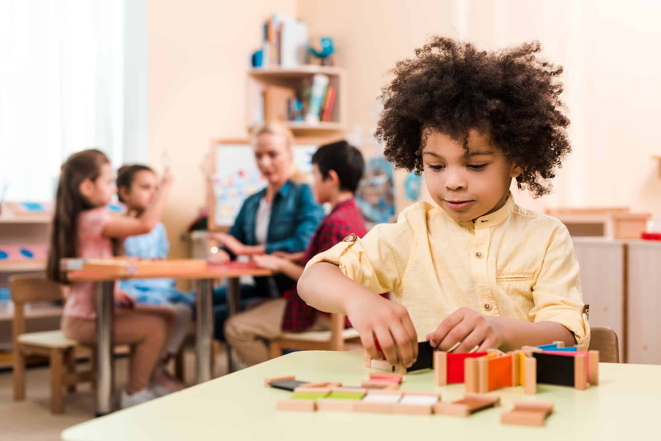 Student playing independently in Montessori classroom