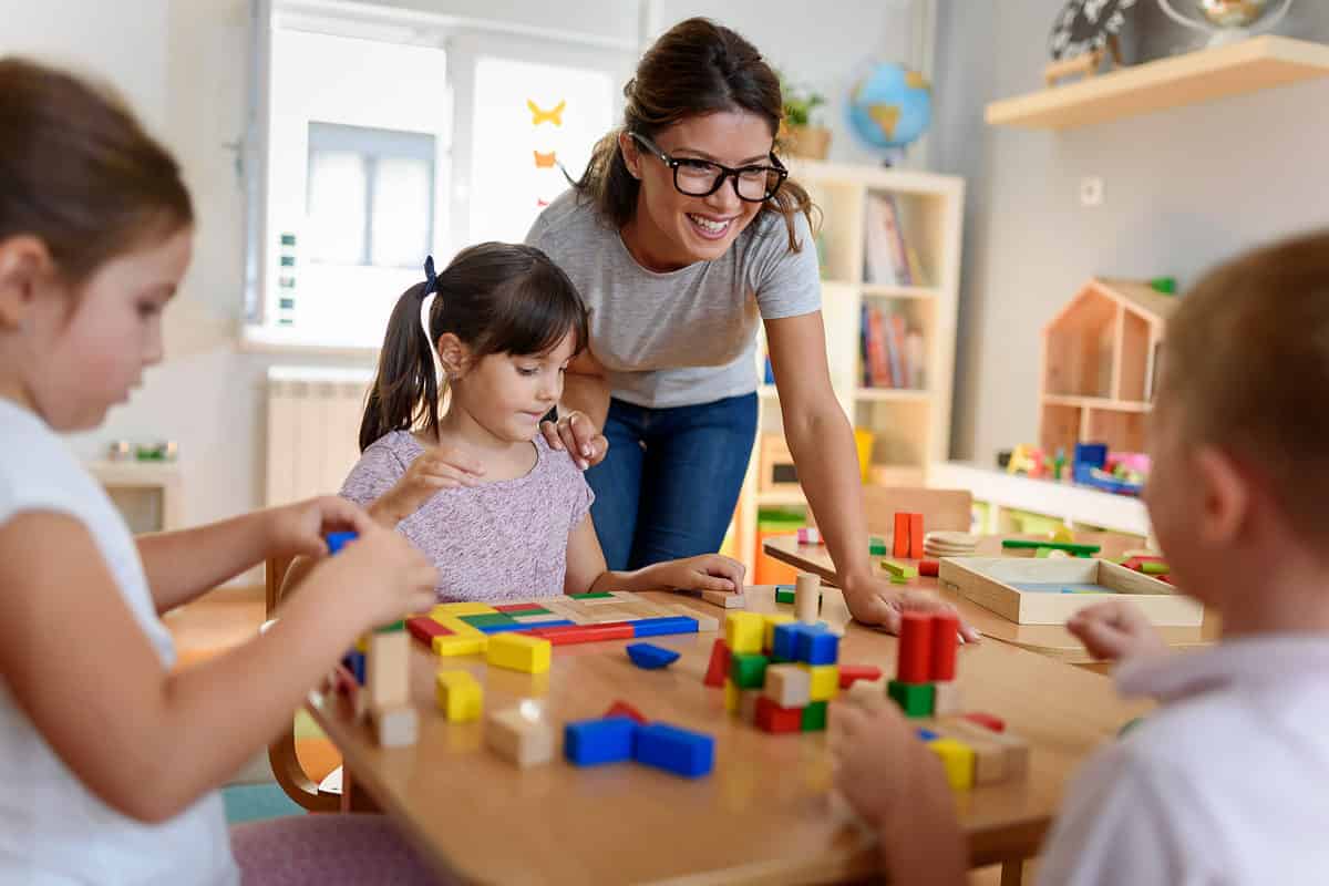 Preschool students playing with blocks