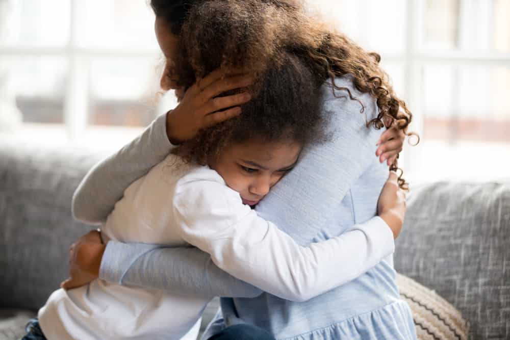 Mother and child hugging