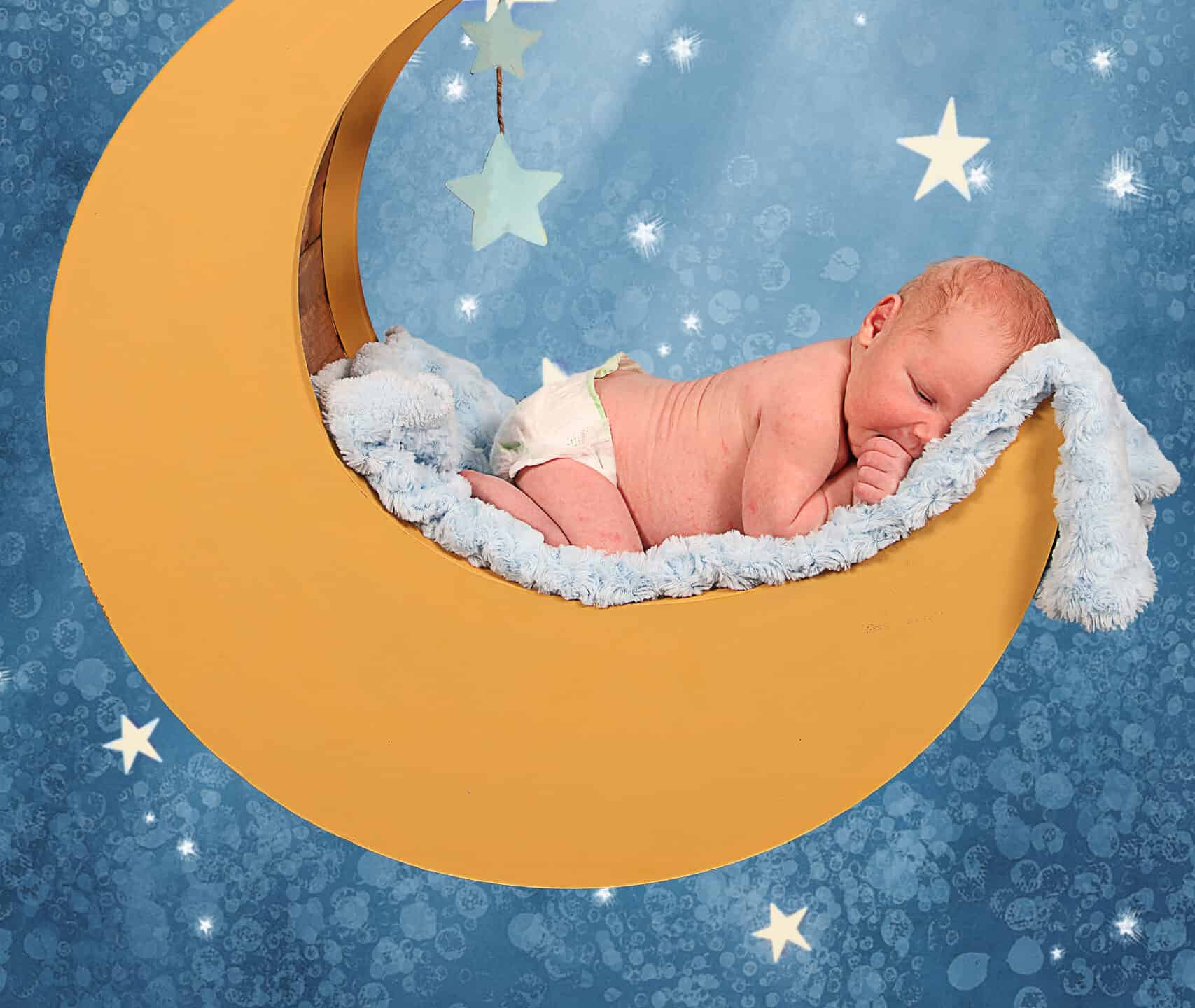 Sweet little baby boy Sleeping in the moon and stars
