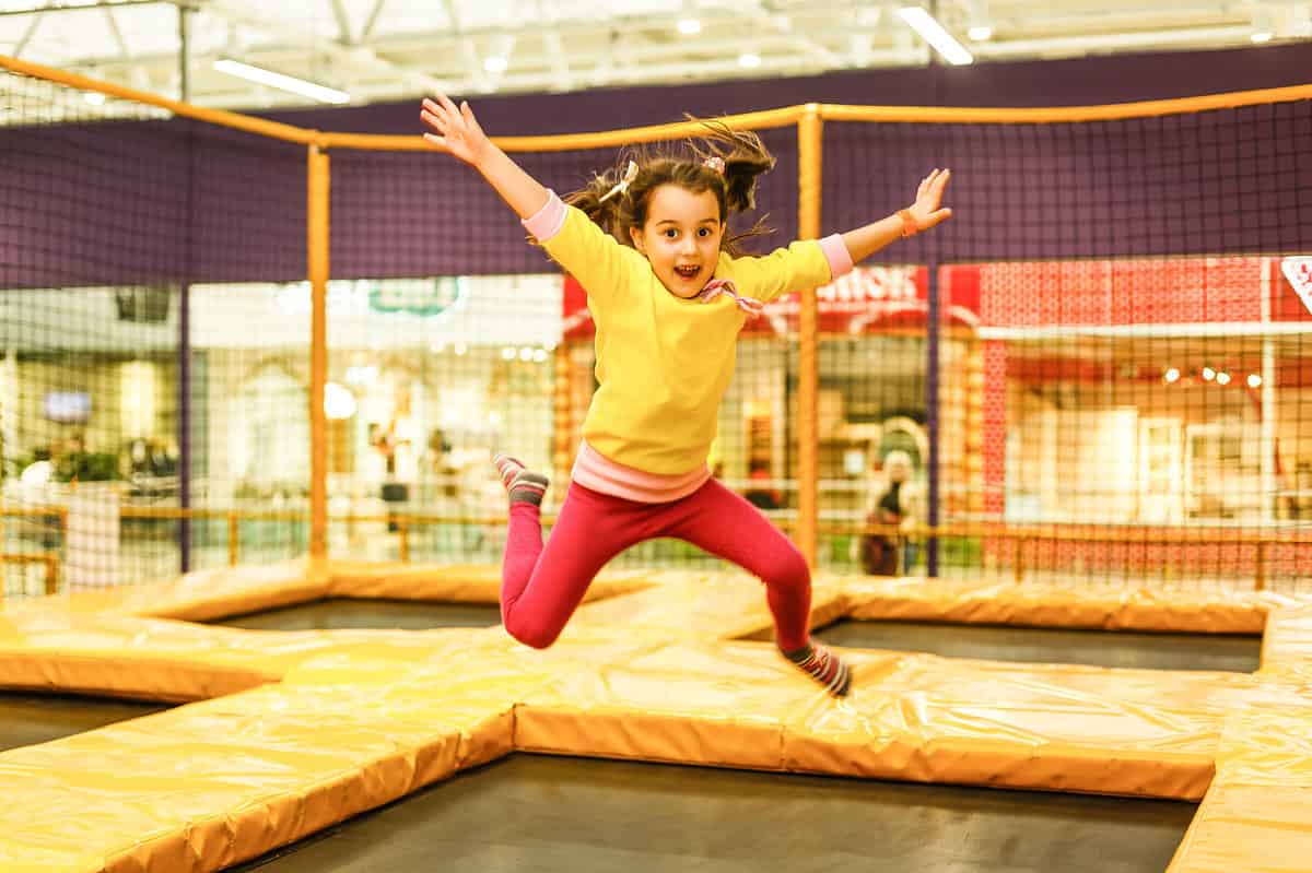 Girl jumping on trampoline