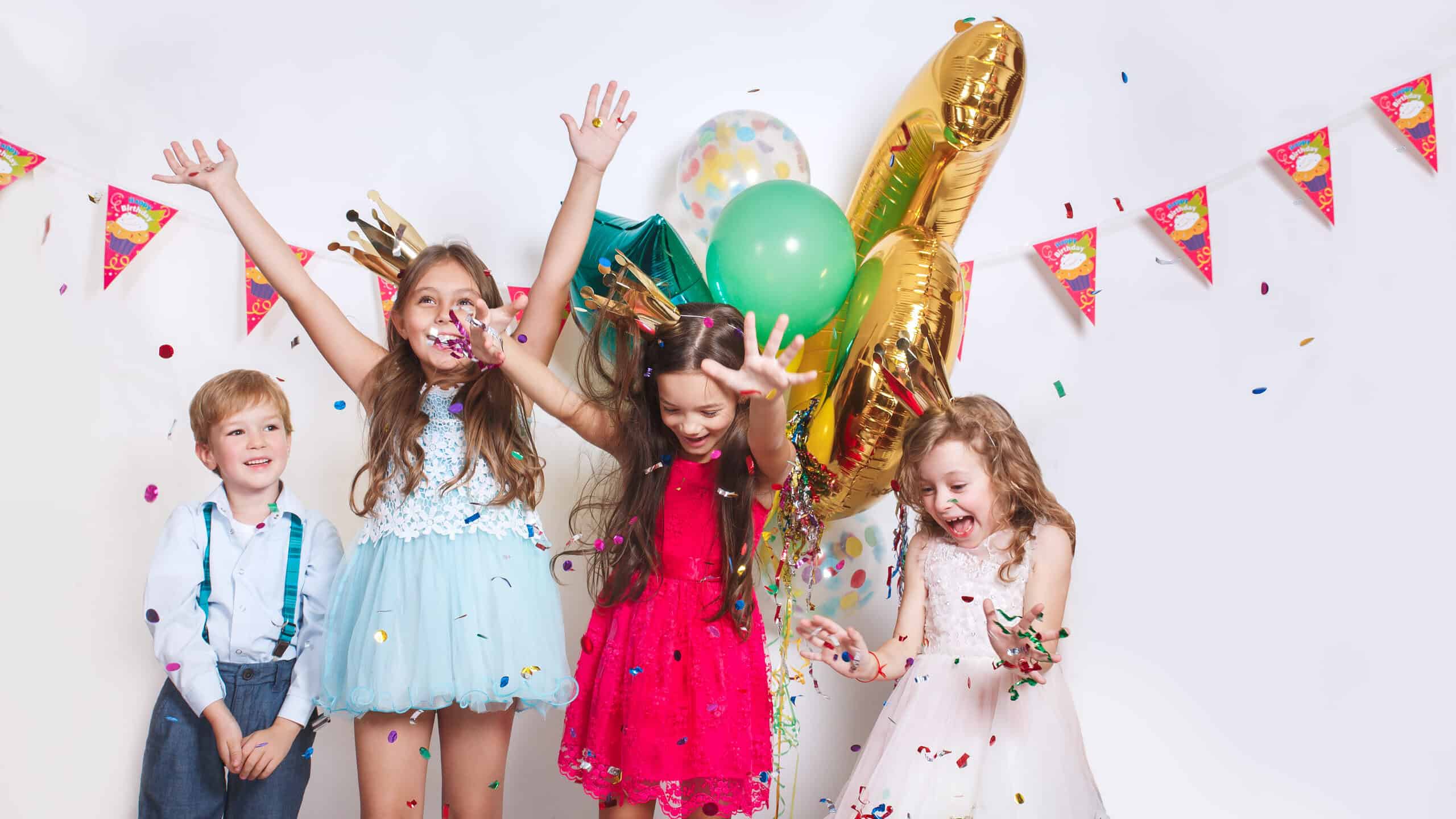 Group,Of,Kids,Throwing,Colorful,Confetti,And,Looking,Happy,On