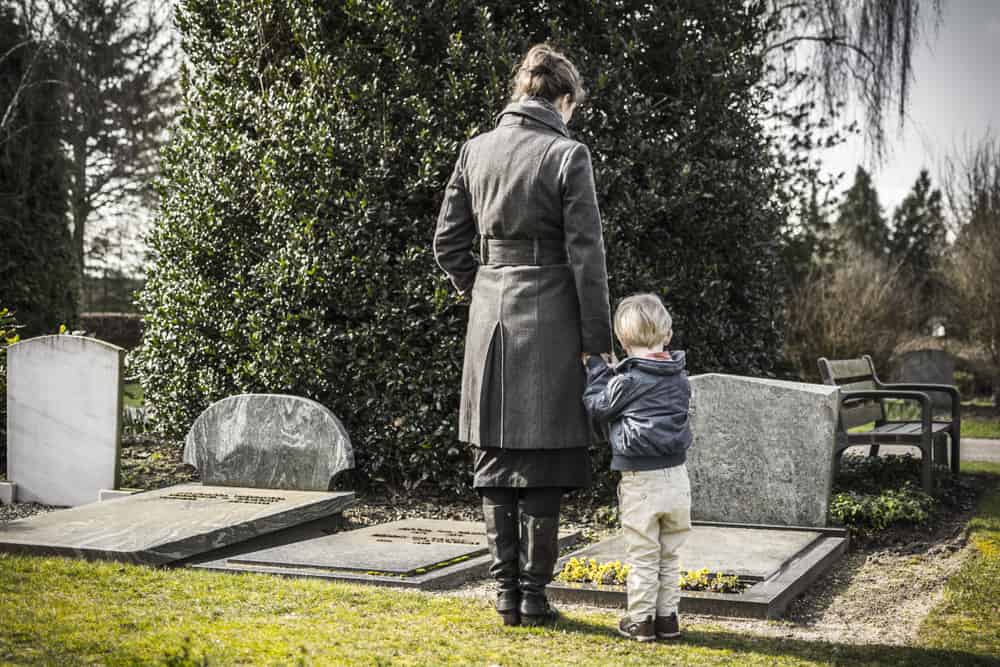 Womand and child at graveyard