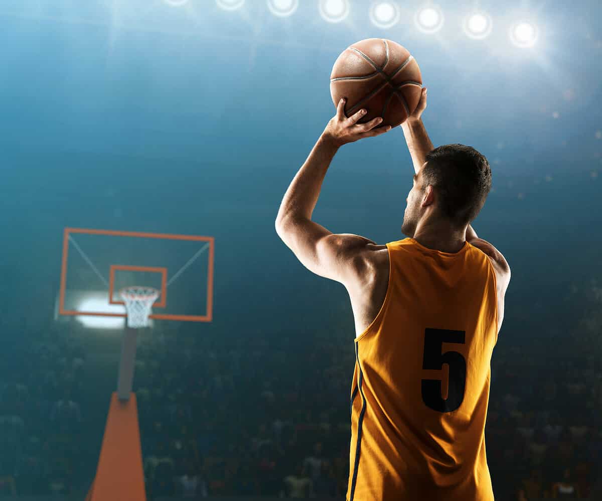 professional basketball player shooting hoops