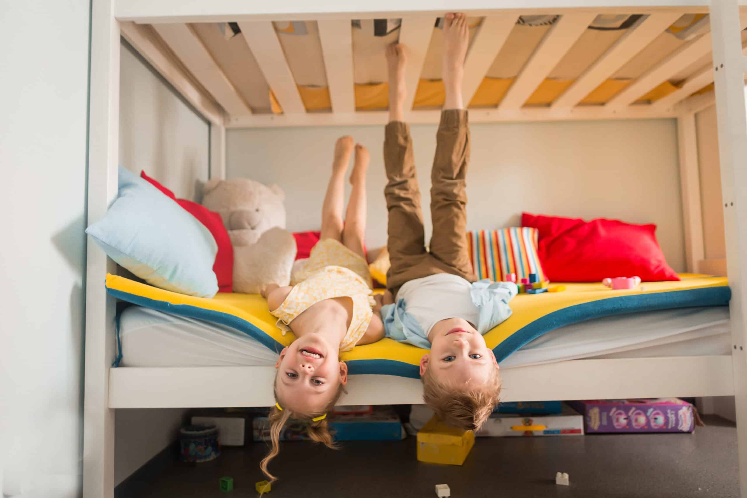 Kids laying in a bunk bed