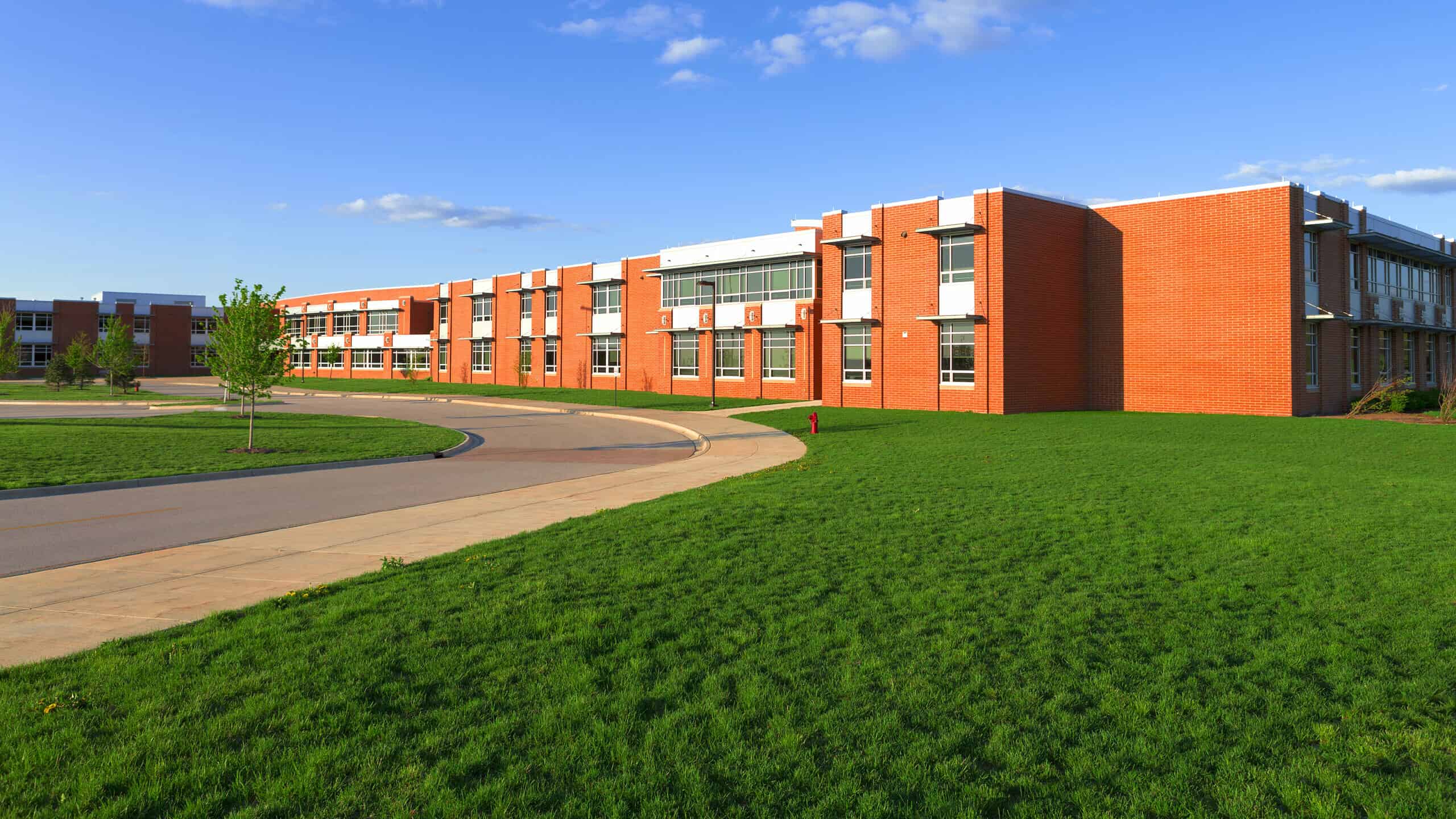 modern school building with a lawn