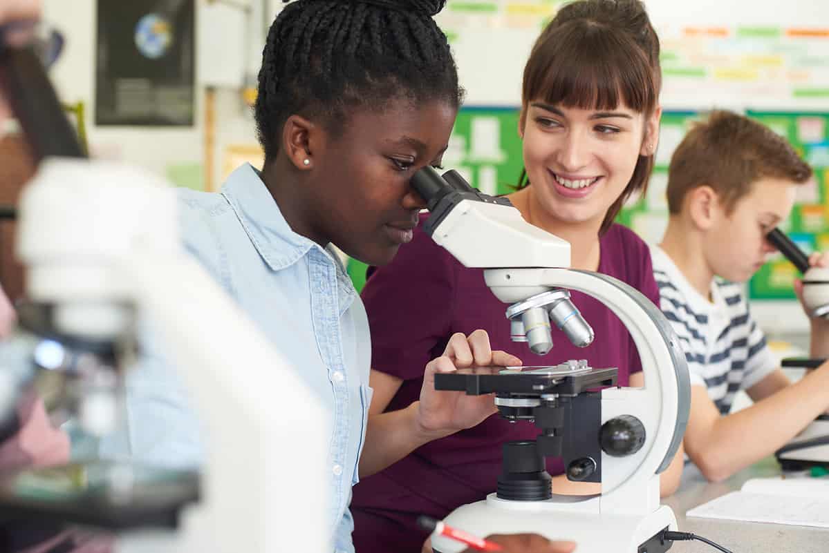 Students using a microscope at the lab.