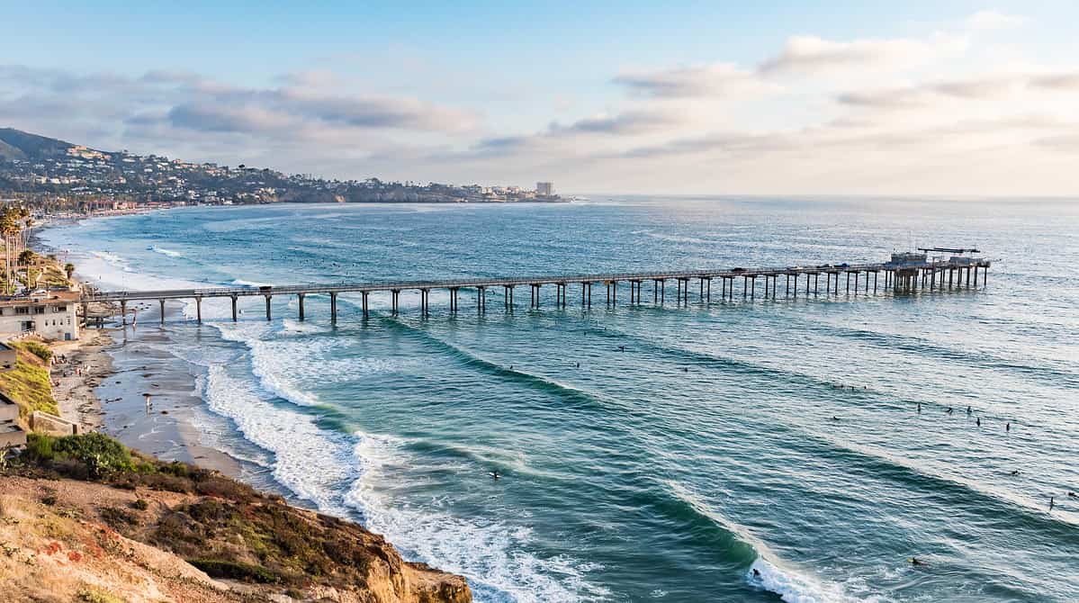 Scripps Pier just before sunset with the La Jolla Cove in the background