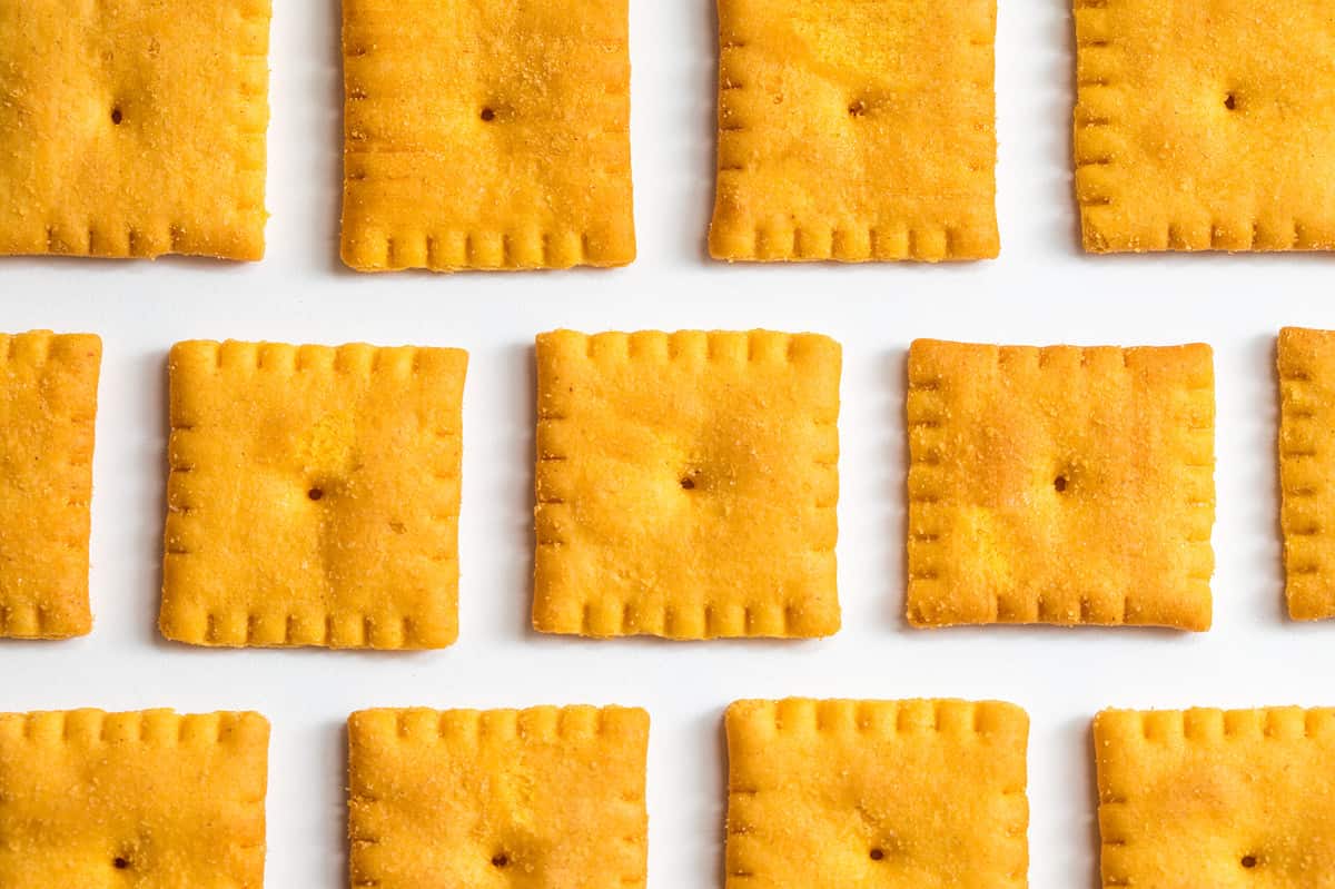 Cheese,Flavored,Small,Square,Crackers,On,A,White,Background