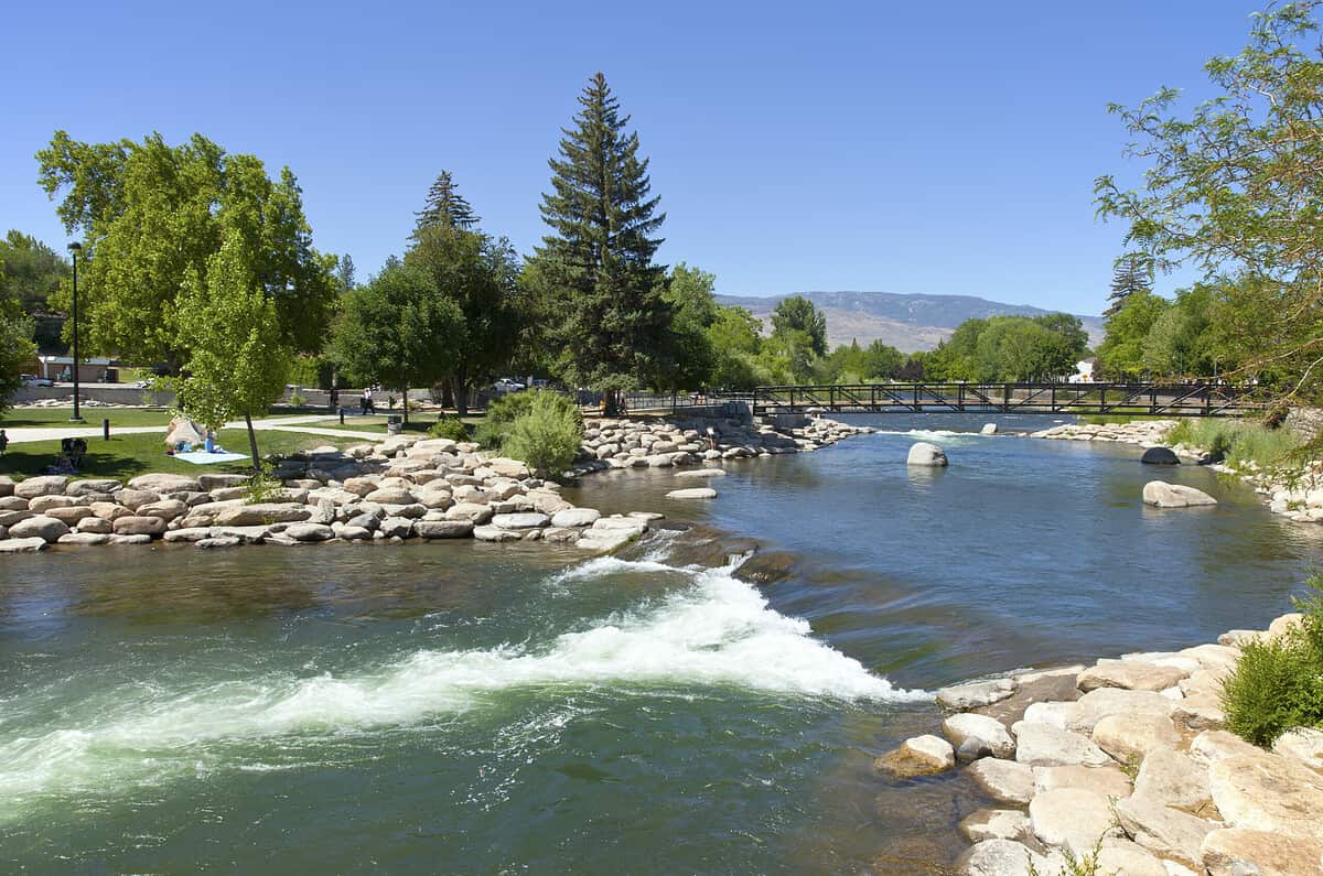 Downtown Reno public park and river with surrounding mountains.