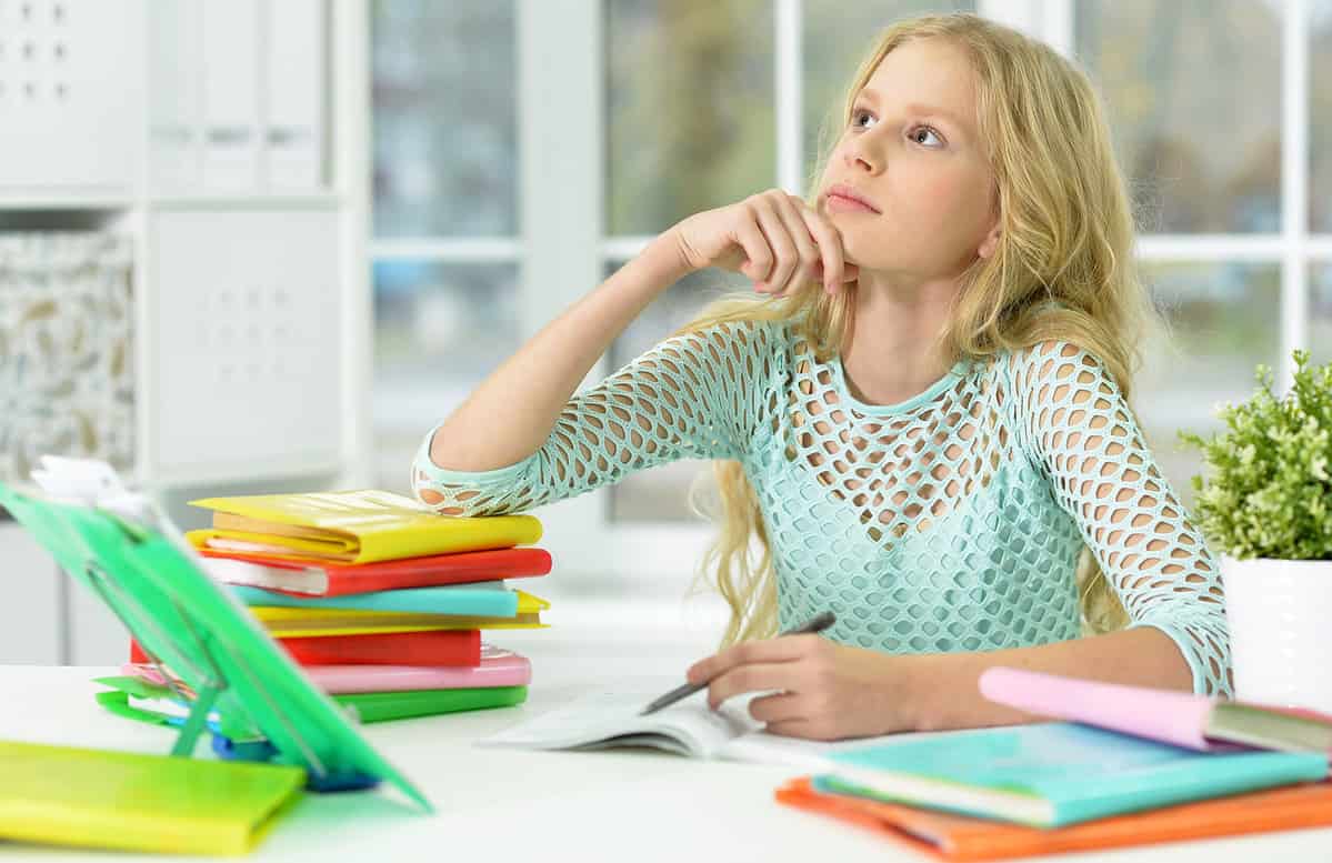 Girl studying and writing