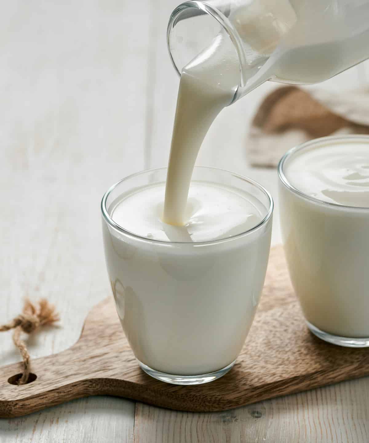 Pouring kefir into glass