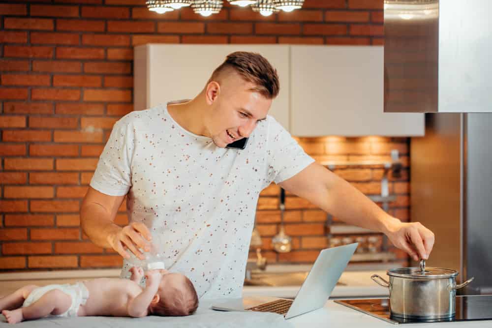 Man,Working,From,Home,,Talking,On,Phone,,Cooking,And,Taking