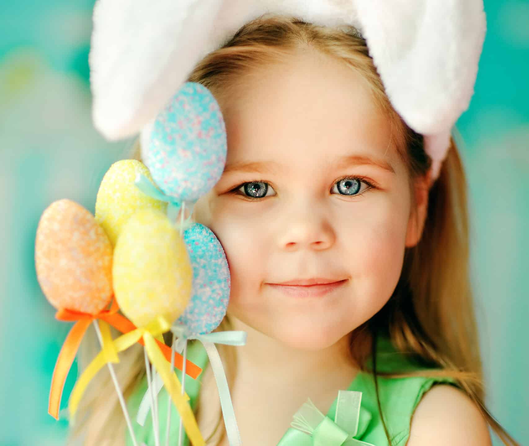 Little girl holding Easter treats