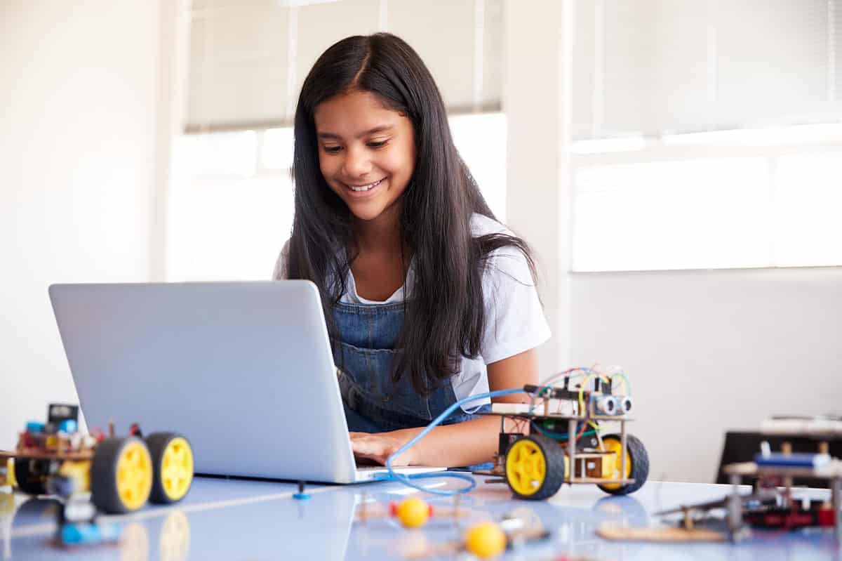 Female Student Building And Programing Robot