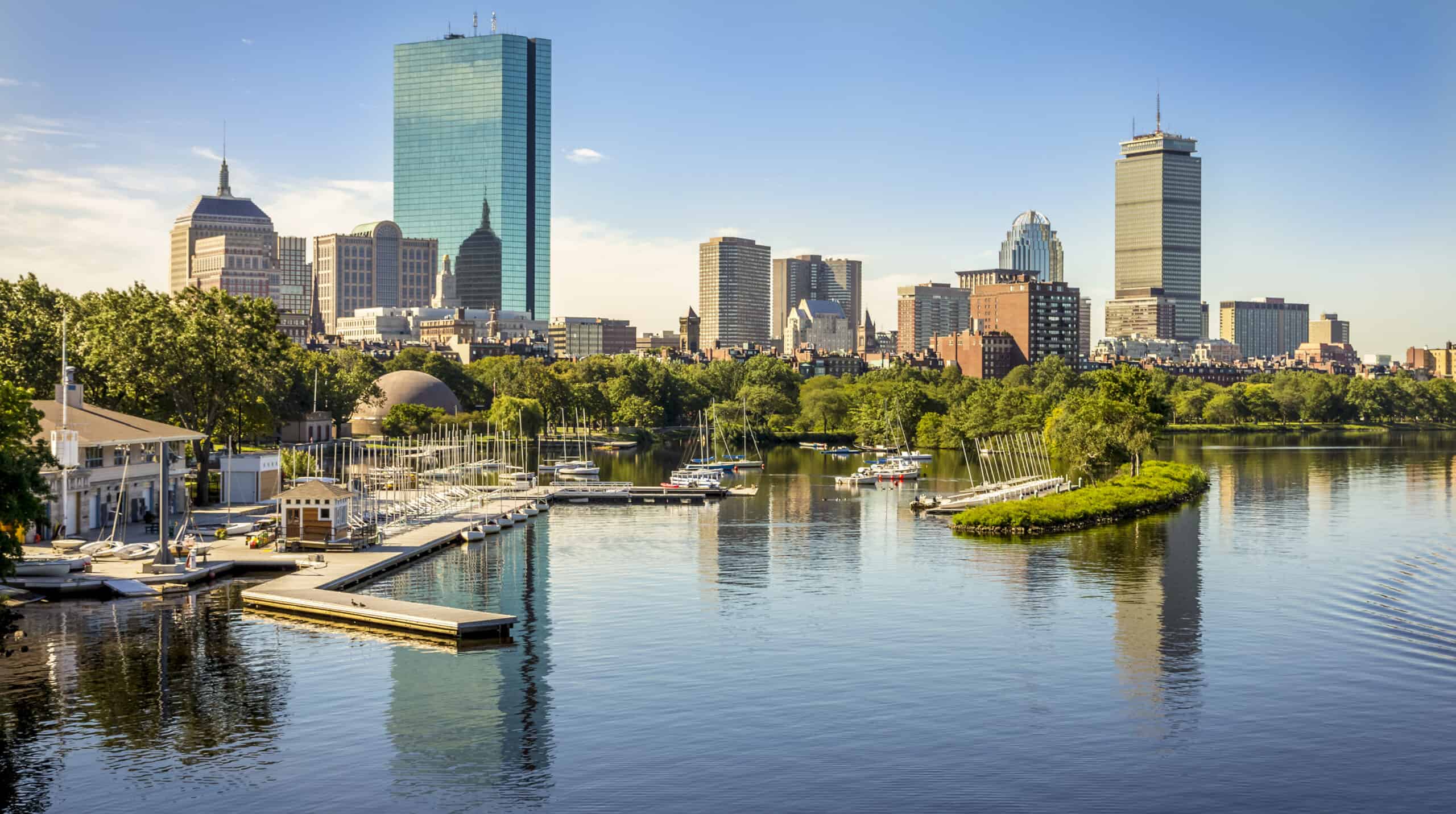 View of the American city of Boston in Massachusetts, USA at Government Center by the Longfellow bridge showcasing its mix of contemporary and historic buildings by the Charles River on a sunny day.