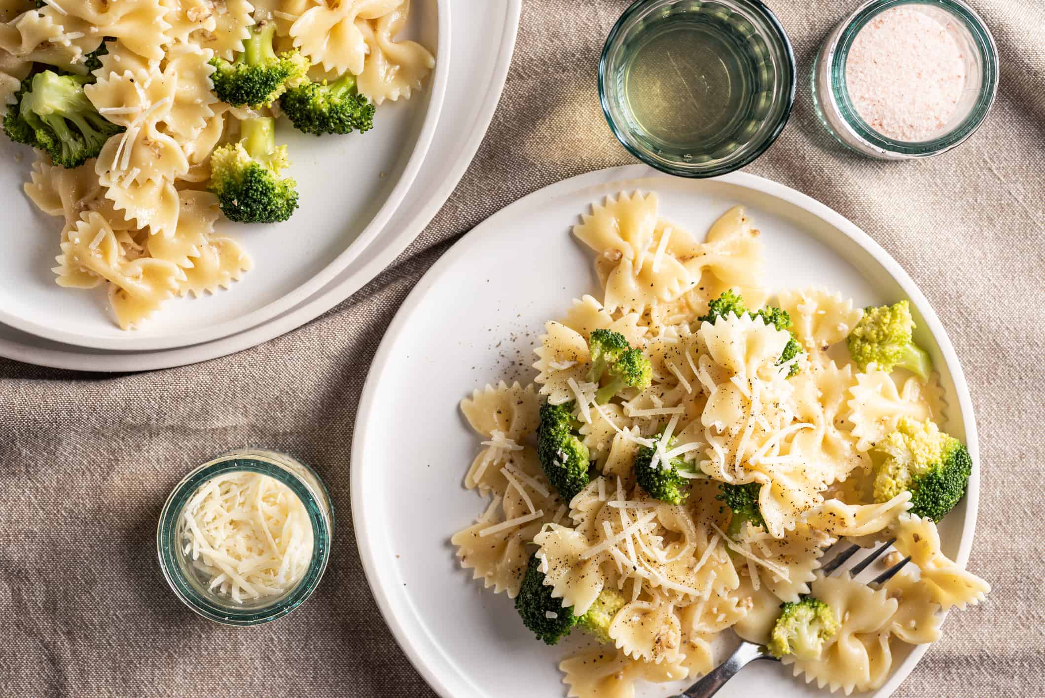 Savory farfalle pasta with walnuts pesto, broccoli and parmesan cheese