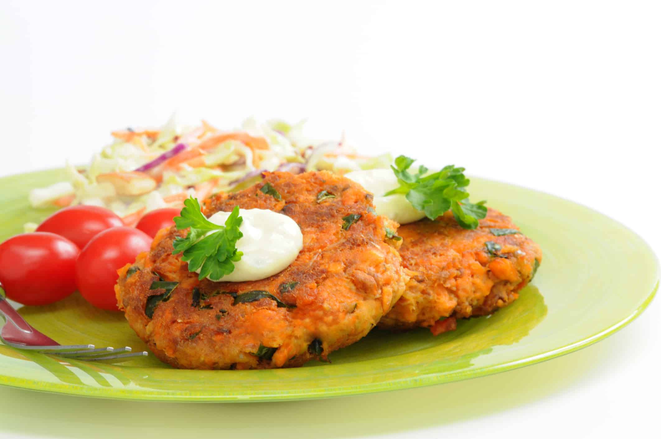 Tasty salmon burgers served with vegetables