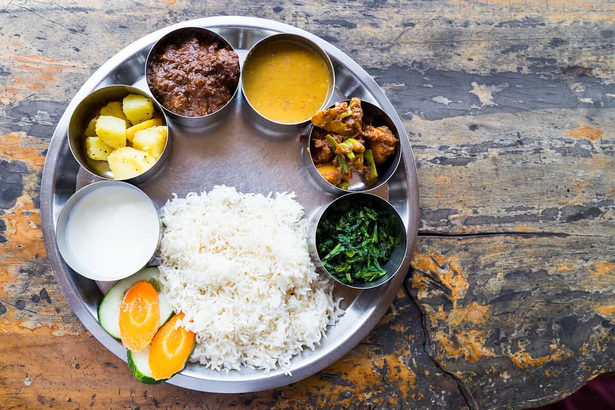 Nepali Thali meal set with mutton curry from top angle