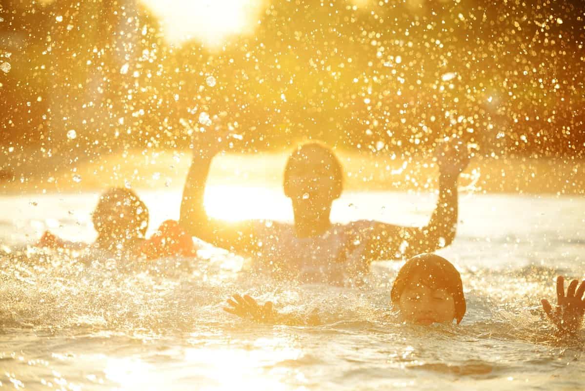 Happy children playing on hot summertime