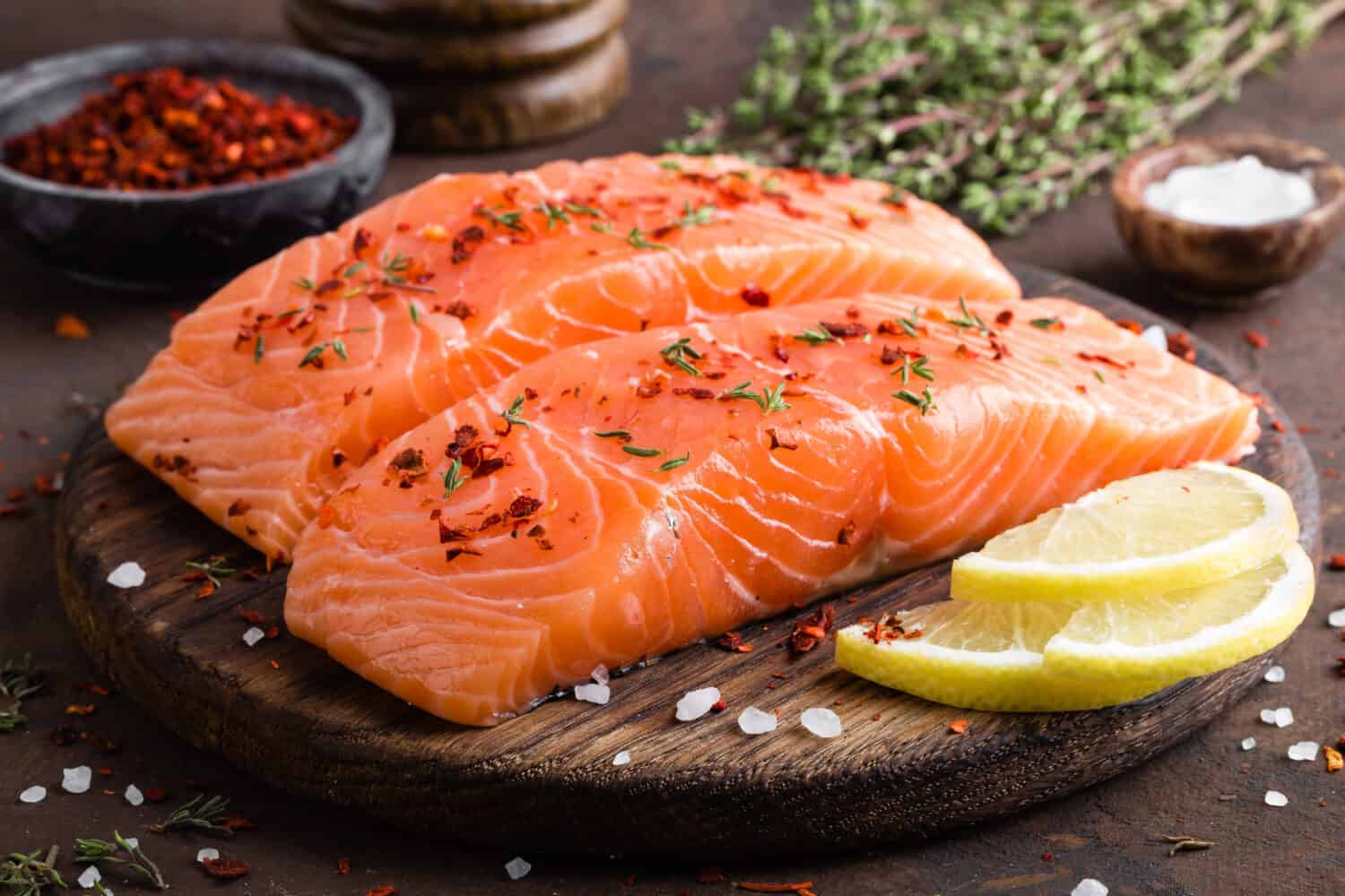 Fresh salmon fish fillet on wooden board