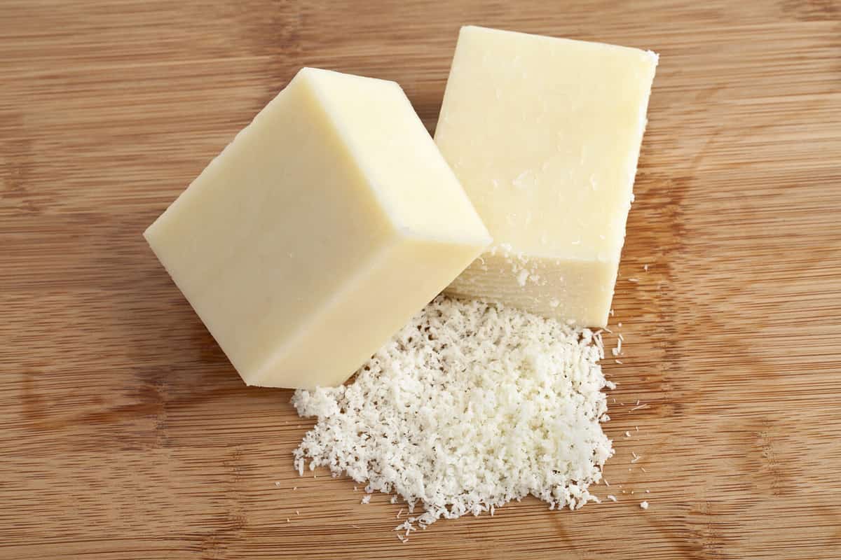 Parmesan Cheese chunks over a wooden background