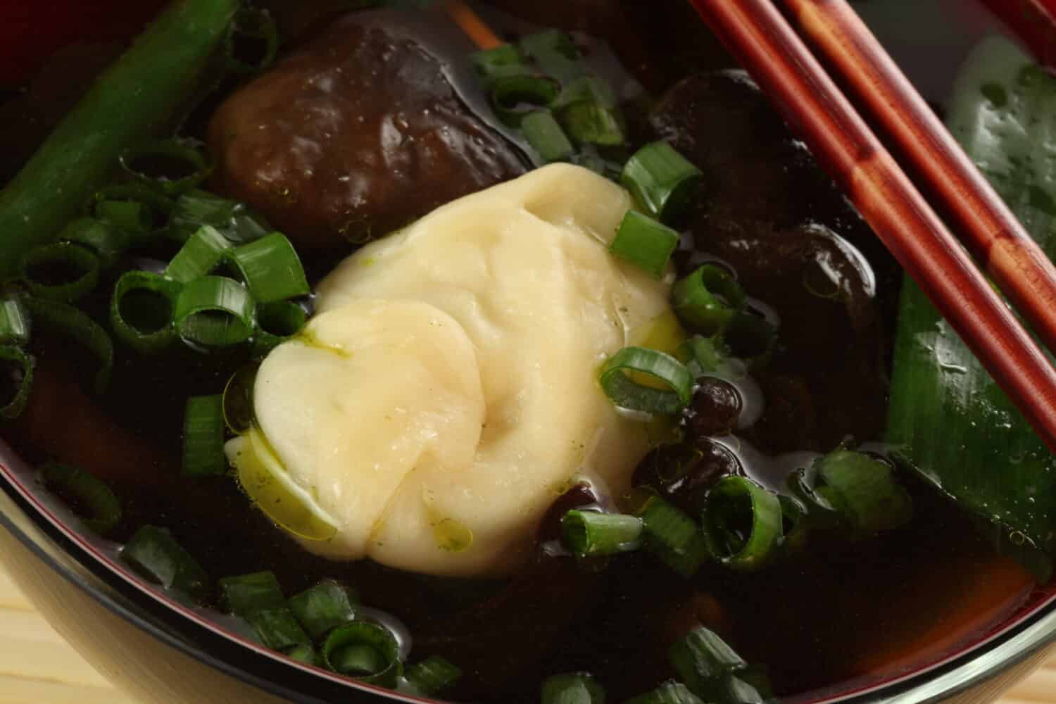 Chinese wonton soup with dumplings and vegetables