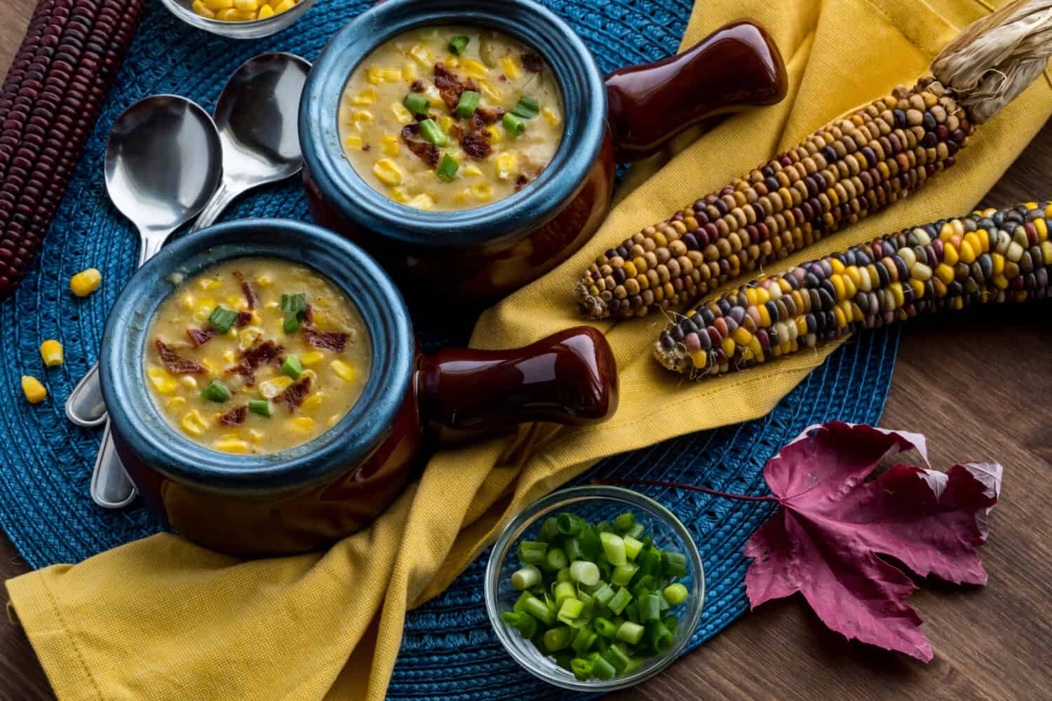 Corn chowder in soup crocks ready for eating.