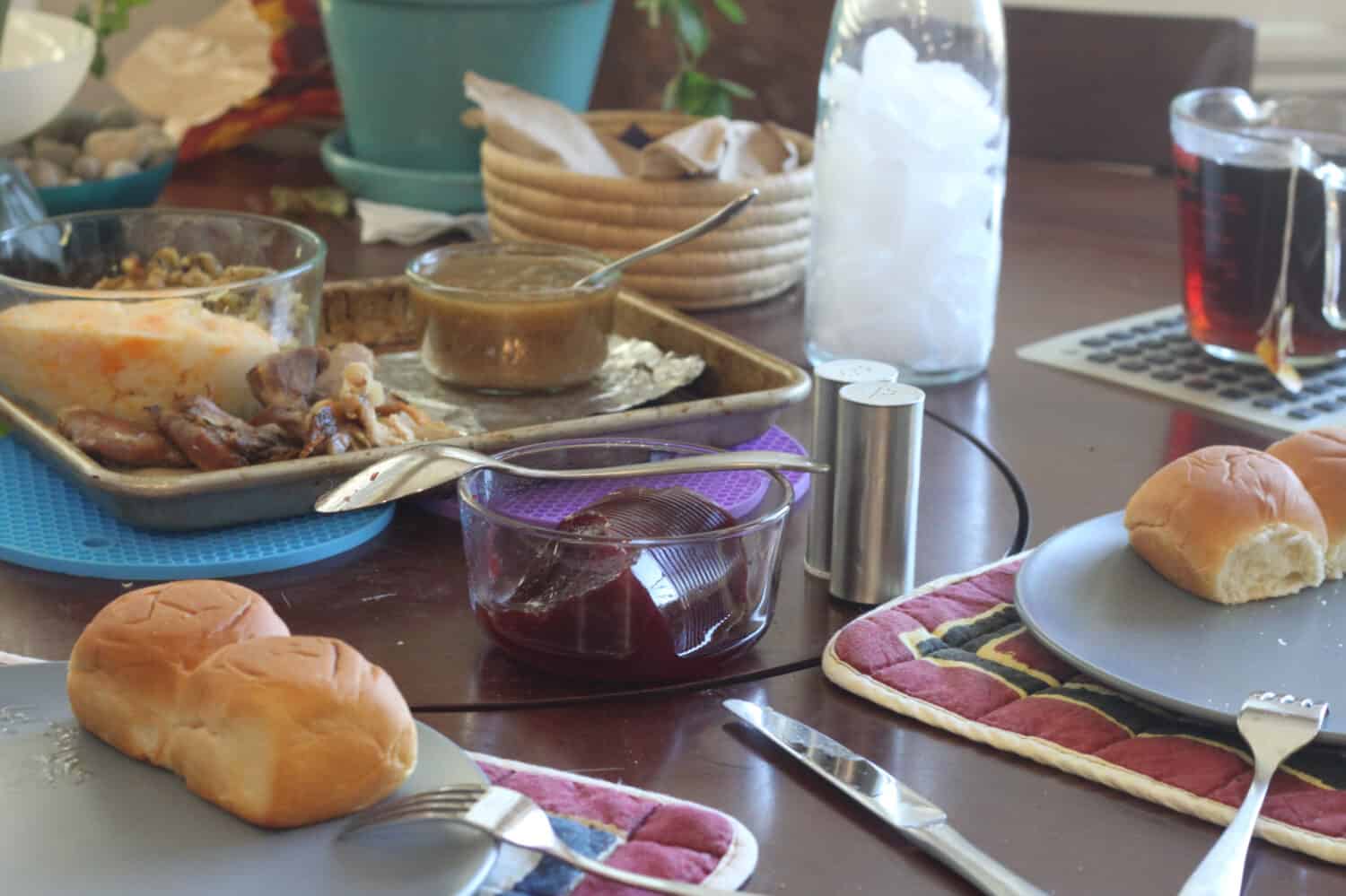 a table set with Thanksgiving food in a jelly roll pan